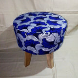 Stool in exotic wood and wax fabrics